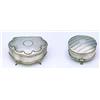 A silver cartouche shaped jewellery box, on four feet, the hinged cover stamped to resemble hammered