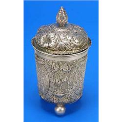 A 19th century Continental covered beaker, engraved with figures within oval reserves and embossed w