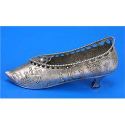 A Dutch shoe-shaped basket, embossed with pastoral scenes, date letter for 1902, (lacking the swing.