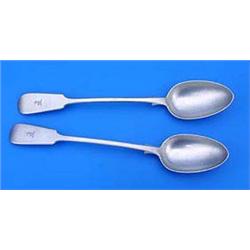 A pair of Victorian fiddle pattern serving spoons, engraved with crests, Exeter 1865 by James and Jo