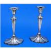 A pair of oval lobed candlesticks with fan fluted vase shaped capitals, tapering stems and bases, Sh