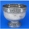 Image 1 : A round punch bowl, the border embossed with trailing flowers, leaves and roundels, on a domed foot.