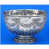 A small round punch bowl embossed with drapery swags, ribbon bows and acanthus, on domed foot, Londo