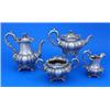 Image 1 : A Victorian four piece tea service, melon fluted and profusely chased and embossed with flowers leav