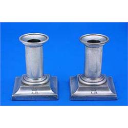 A pair of Victorian short candlesticks with plain round columns and square bases, with initials 'LR'