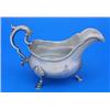 Image 1 : An early George III sauce boat with gadrooned border, leaf capped double scroll handle on shell and.