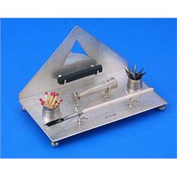 A Victorian ink stand in the form of an open envelope, the inkwell with a clear glass liner, with a.
