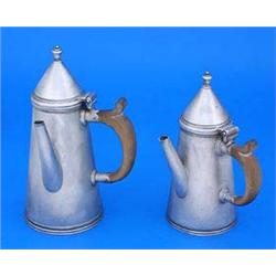 A pair of graduated small coffee pots, of straight tapering form with wood side handles and conical.