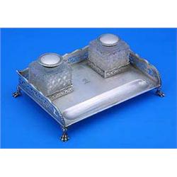 A rectangular ink stand with a pierced gallery with wavy gadrooned border on paw feet, and engraved.