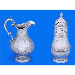 A Victorian baluster milk jug, engraved with strapwork, cartouches and a monogram with a leaf capped