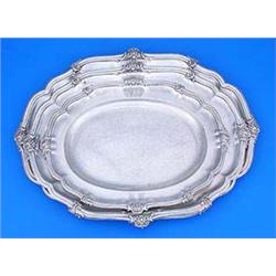 A set of three Victorian graduated oval meat dishes, each with a shaped moulded, shell and scroll ch