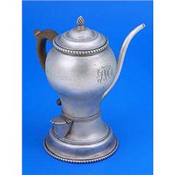 An early George III argyle, the round body with a monogram, slim spout and wood side handle, on spre