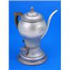 An early George III argyle, the round body with a monogram, slim spout and wood side handle, on spre