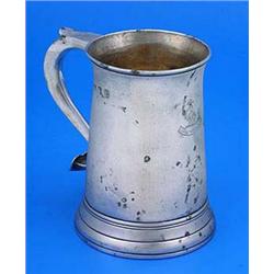 A George III mug, the straight tapering sides with everted rim and slightly spreading base, the 'S'.
