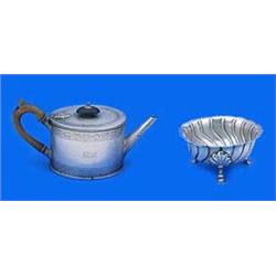 A Victorian oval teapot and a round sugar bowl, the teapot with beaded borders and engraved with ban