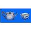 A Victorian oval teapot and a round sugar bowl, the teapot with beaded borders and engraved with ban