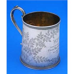 A Victorian straight sided christening mug with beaded borders and scroll handle, engraved with flow