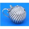 A Victorian spherical mustard pot, spirally fluted, the hinged cover with a fan shaped thumb piece,.