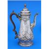 A late George II pear shaped coffee pot embossed with flowers and scrolls and engraved with a cartou