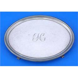 A George III small oval salver with a reeded border, bracket feet and engraved with a monogram, Lond