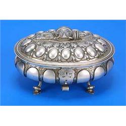 An oval casket/sugar box in Charles II style with ovolo and acanthus embossing, a coiled rope handle