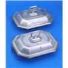 A pair of canted rectangular entree dishes, covers and handles each with moulded borders and engrave