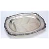 A 'well and tree' meat dish, shaped oblong with a flower, shell and scroll chased border on ball fee