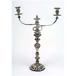 A pair of 19th century candlesticks and a pair of associated two branch candelabra arms, the shaped-