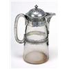 A straight tapering glass jug with engraved mounts and loop handle, the domed cover with knopped fin