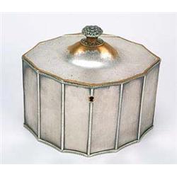 A George III Sheffield oval tea caddy, the concave fluted sides with beaded borders, the domed hinge