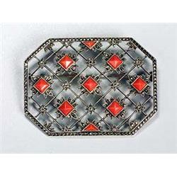 A stylish German marcasite and coral brooch, of rectangular shape with canted corners with an openwo