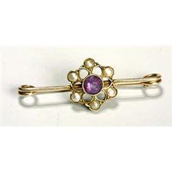 A Murrle Bennett gold, pearl and amethyst bar brooch, with simple pin centred with floret-shaped pla