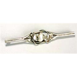 A French Art Nouveau brooch, by Dumont, of bar shape with a central panel of mother of pearl panel f