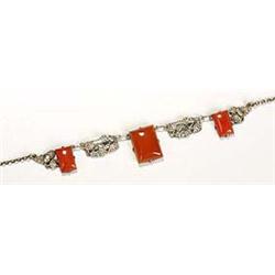 An Arts and Crafts carnelian necklace, possibly Birmingham School, having three graduated rectangula