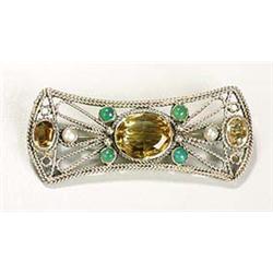 An attractive Arts and Crafts brooch, of openwork form embellished around its edges with rope-twist.