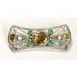 An attractive Arts and Crafts brooch, of openwork form embellished around its edges with rope-twist.