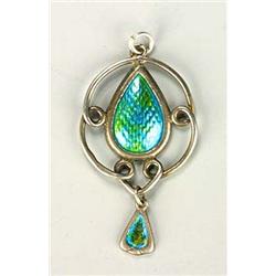 A Charles Horner enamelled pendant, with central teardrop plaque enamelled in greeny-blue, within a.