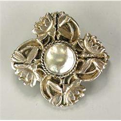 A Charles Horner silver and mother of pearl brooch, with a central nacreous plaque encircled by lotu