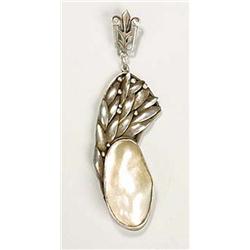 An Arts and Crafts pendant, with an oval plaque of blister pearl held within a mount of overlapping.