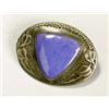 A Ruskin Pottery triangular plaque mounted as a brooch, of lavender tone and mounted in an oval pewt