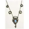 An Arts and Crafts moonstone necklace, probably Birmingham School, the pendant has a central moonsto