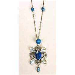 An Arts and Crafts moonstone and swiss-lapis necklace, the pendant having a plaque of swiss lapis fl