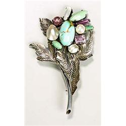 A large Arts and Crafts brooch, attributed to Bernard Instone, fashioned as a highly-stylised bouque