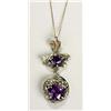 A Bernard Instone Arts and Crafts pendant, of circular shape with a facetted amethyst held within a.