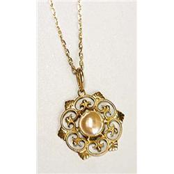 A Liberty & Co gold pendant, of stylised openwork floral form and centred with a plaque of blister p