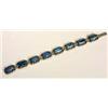 An Art Deco swiss-lapis and marcasite bracelet, composed of eight rectangular plaques with canted co