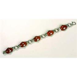 A carnelian-set Bracelet, composed of five oval cabochons of carnelian held within foliate mounts an