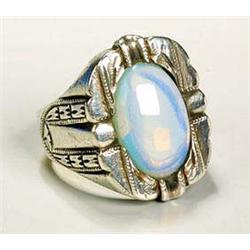 A stylish water opal ring, having a shallow oval cabochon of opal, the top and shanks of the ring ge