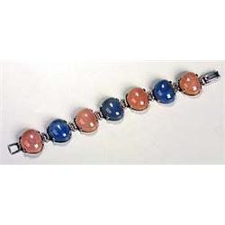 An attractive rose quartz and blue-stained chalcedony bracelet, the seven pebble-like cabochons alte