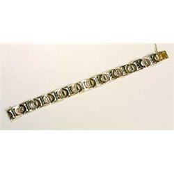 A stylish French Art Deco bracelet, composed of  eleven rectangular plaques, fashioned in three colo